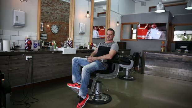Barber shop owner David Tutalo: "It's just another day, you've got to vote."