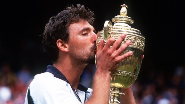 Real wild card: Goran Ivanisevic celebrates the Wimbledon trophy he won in 2001 while ranked No.125 in the world.