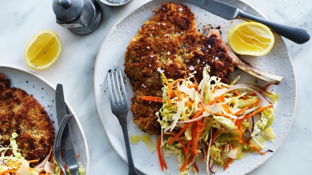 Veal cotoletta with coleslaw.