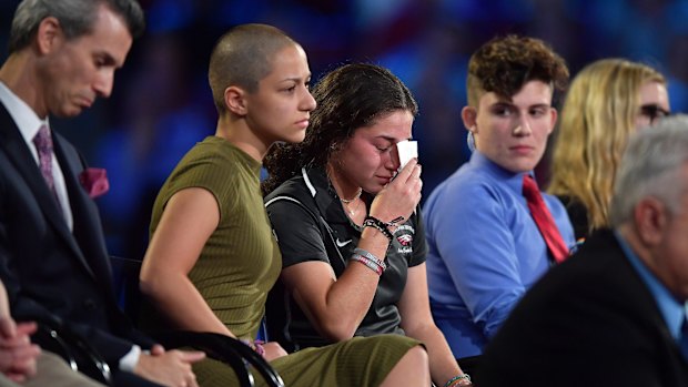 High School student Emma Gonzalez comforts a classmate during a CNN town hall meeting.