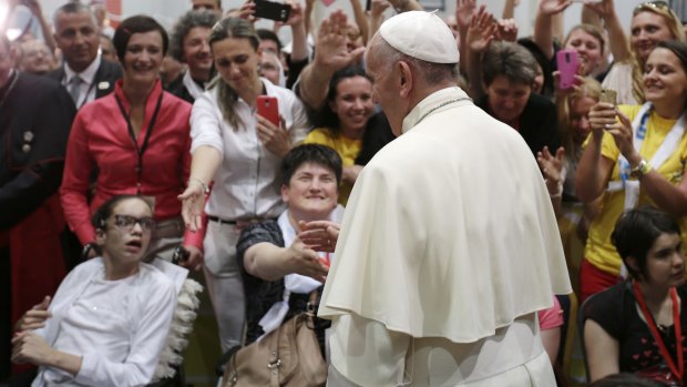 Pope Francis meets people in a youth centre dedicated to Pope John Paul II during his visit to Sarajevo, Bosnia and Herzegovina. 