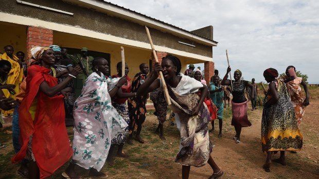 Women supporters of the opposition dance at the opposition's base camp on the outskirsts of Juba.
