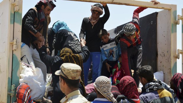Civilians from Fallujah flee their homes last week. 