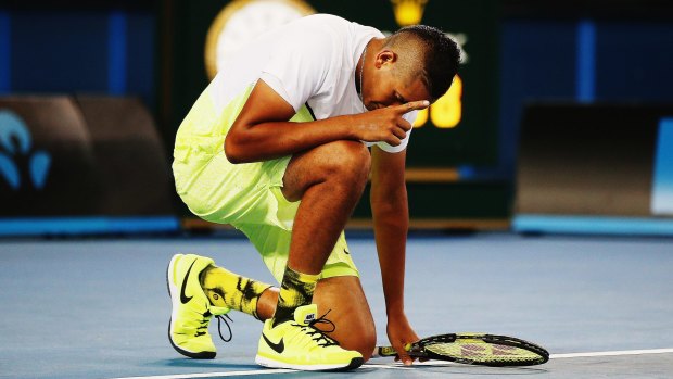 Nick Kyrgios goes down on knee after defeating Federico Delbonis of Argentina.