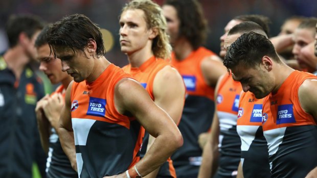 Dog of a day: Ryan Griffen (left) and the Giants come to terms with their preliminary final loss to the Western Bulldogs.