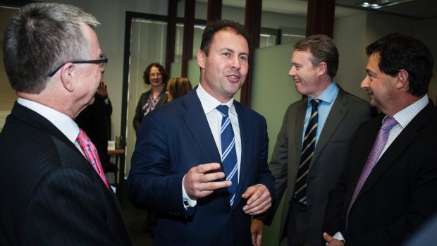 Josh Frydenberg talking to former Rio Tinto managing director David Peever at a Business Council of Australia event last year.
