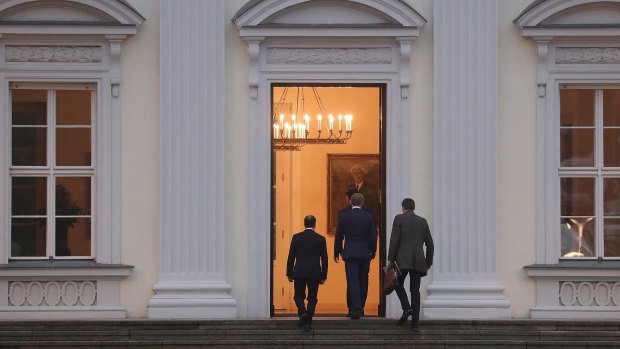 Christian Lindner, leader of the Free Democratic Party, centre, arrives at the Schloss Bellevue Presidential Palace for talks with German President Frank-Walter Steinmeier on Tuesday.