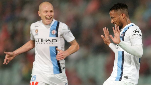 Harry Novillo (right) celebrates with teammate Aaron Mooy after scoring against the Western Sydney Wanderers on Friday.