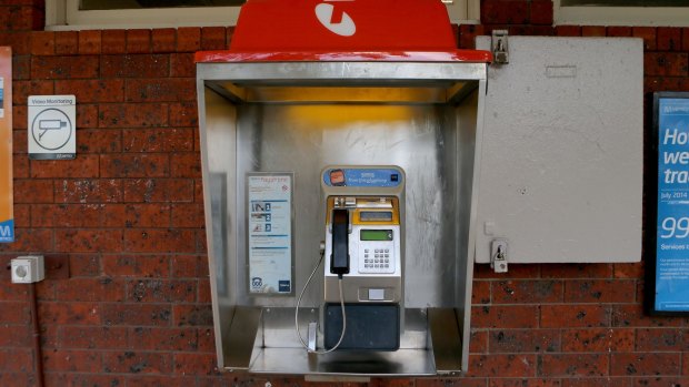 A Telstra pay phone at a train station.