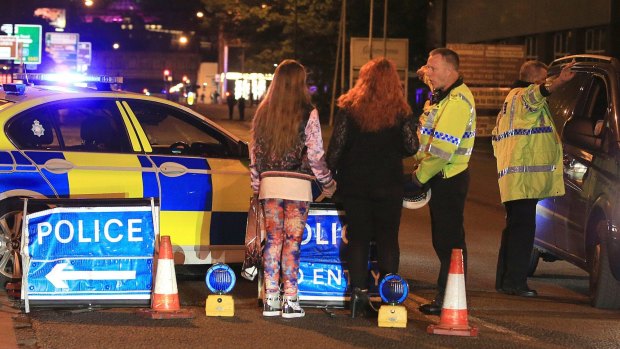 Police at Manchester Arena after reports of an explosion.