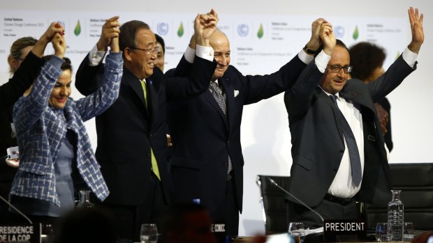 United Nations climate change chief Christiana Figueres, UN Secretary-General Ban Ki-moon, French Foreign Affairs Minister and UN Climate Change Conference in Paris president Laurent Fabius and French President Franois Hollande celebrate the agreement on climate change.