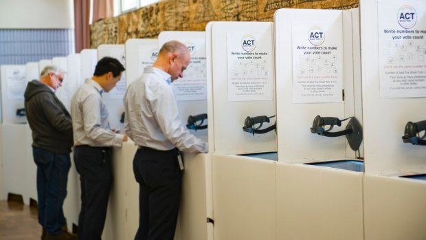 Canberrans cast their vote in the ACT election at Pilgrim House in Northbourne Avenue on Thursday. 
