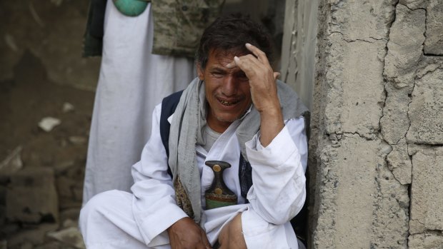 A man cries after some of his relatives were killed in a Saudi-led airstrike in Sanaa, Yemen on Monday.