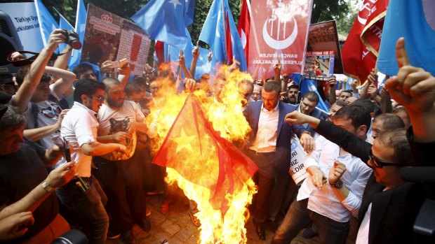 Demonstrators set fire to a Chinese flag during a protest against China near the Chinese Consulate in Istanbul, Turkey last month.