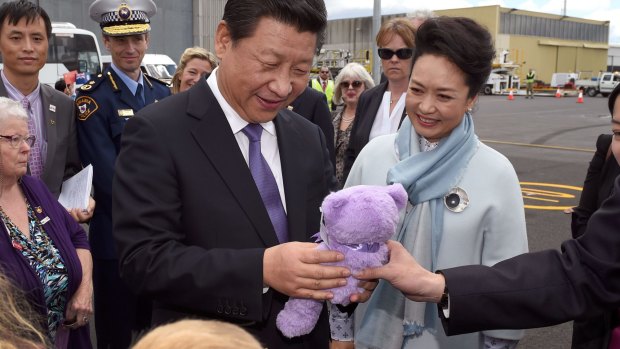 Chinese President Xi Jinping and his wife, Peng Liyuan, are presented with a Bobbie bear at Hobart on Tuesday.