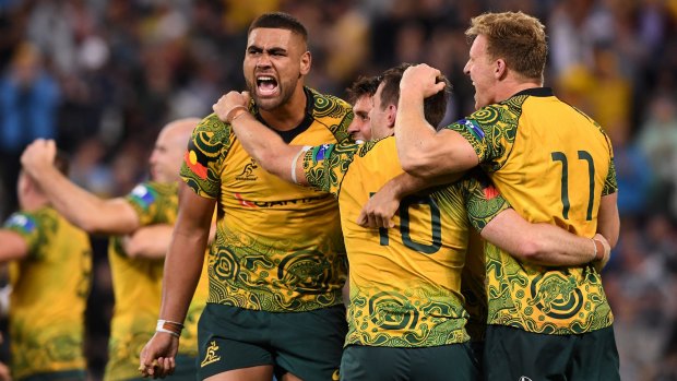 Famous win: The Wallabies celebrate after beating the All Blacks at Suncorp Stadium.