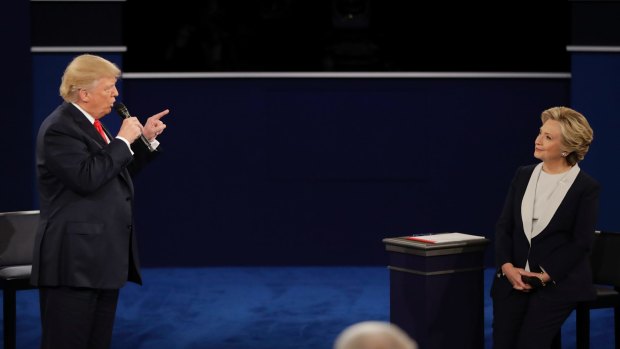 Donald Trump points towards Hillary Clinton during the second presidential debate.