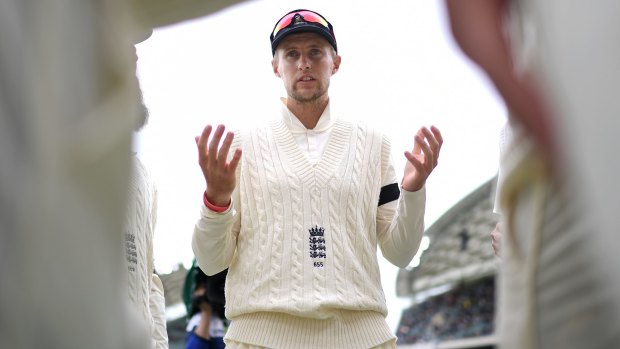 England captain Joe Root talks to his players at Adelaide Oval.