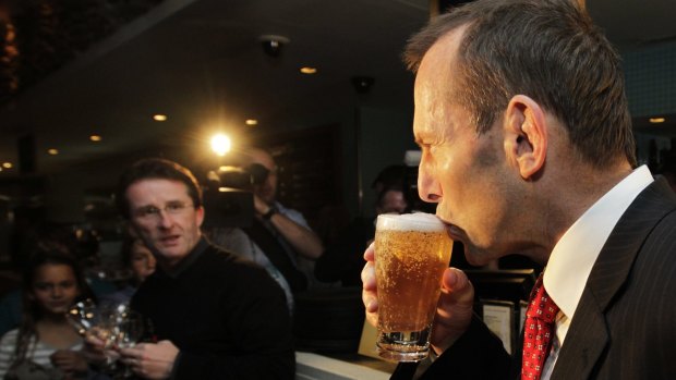 Tony Abbott enjoys a beer during his time as opposition leader.