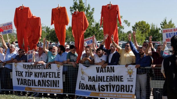 Supporters of President Erdogan with a banner that reads: " We want the death penalty." 