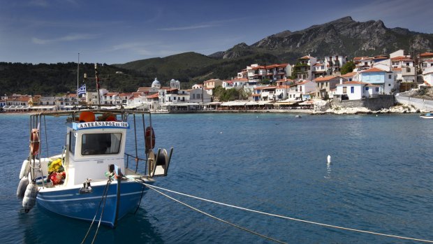  A Greek caique (fishing boat) is  moored in Kokkari bay, on the Greek island of Samos. 