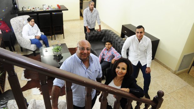 Hani Sidaros with his wife Gehan and their children, back from left, Jesse,17, Axel, 21, Jacob,10, and Josh,19, at their family home in O'Malley.