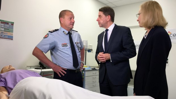 Health minister Cameron Dick, with chief health officer doctor Jeannette Young and Queensland Ambulance Service commissioner Russell Bowles, said flu season has not peaked yet.