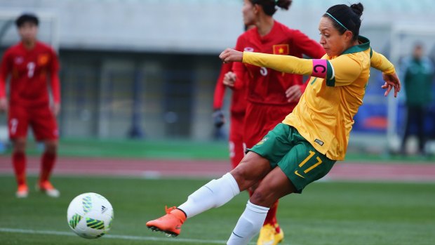 Kyah Simon scores her team's second goal during the AFC Women's Olympic final qualification round match between Australia and Vietnam in Japan.  