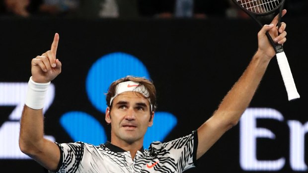 Switzerland's Roger Federer celebrates after defeating compatriot Stan Wawrinka in their semi-final.