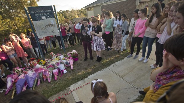 Local residents congregate near where Masa Vukotic was murdered.