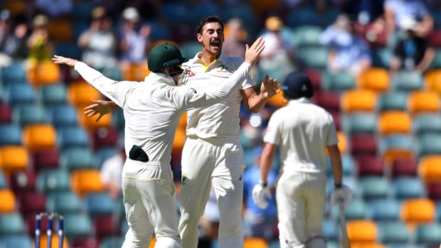 Knockout blow: Mitchell Starc celebrates the wicket of Chris Woakes.