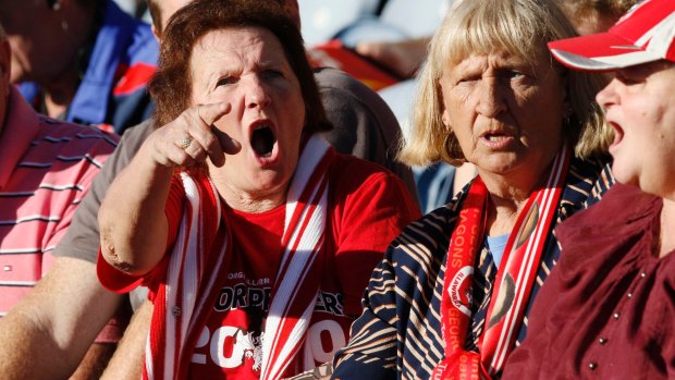 Dragons fans show their displeasure at a disallowed try against the Knights.