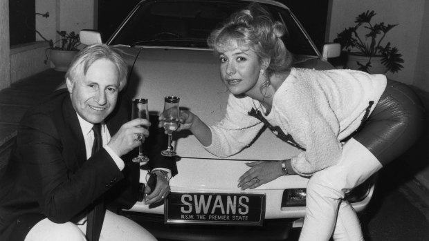 Glory days: Geoffrey Edelsten and Leanne toast buying the Sydney Swans licence in August 1986.