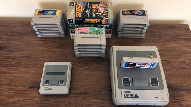 The tiny SNES Mini, alongside an original Aussie SNES and 20 games.