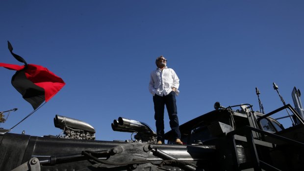 Production designer Colin Gibson atop the War Rig from Mad Max: Fury Road.