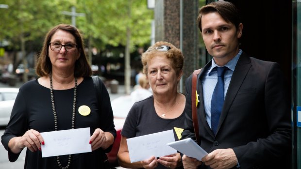 Anti-CSG protestors present letters to the Sydney office of Santos' new chief executive, Kevin Gallagher.