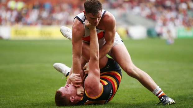 Close-fought: Tom Lynch of the Crows and Heath Shaw of the Giants get to grips.