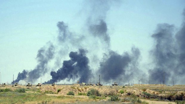 Smoke rises after airstrikes by US-led coalition warplanes on Sunday as Iraqi security forces advance their positions in the southern neighborhoods of Fallujah to retake the city from Islamic State militants.