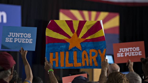 Attendees hold signs while waiting for Tim Kaine, 2016 Democratic vice presidential nominee in Phoenix, Arizona.
