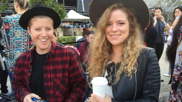 Chloe Donnelly and India Hartford line up to catch the ferry to Wednesday's Justin Bieber performance in Sydney.