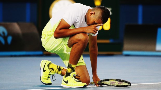 Nick Kyrgios goes down on one knee after defeating Federico Delbonis of Argentina.