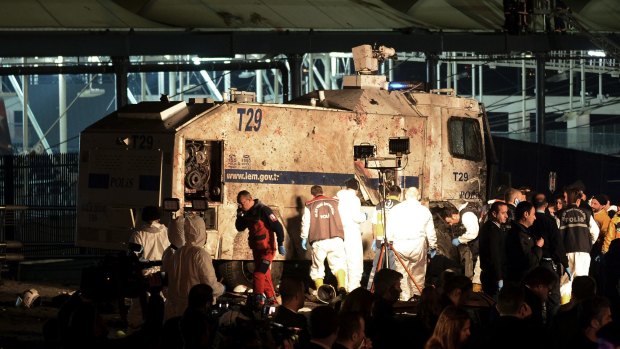 Forensic teams at the scene of the explosions near the Besiktas stadium in Istanbul.