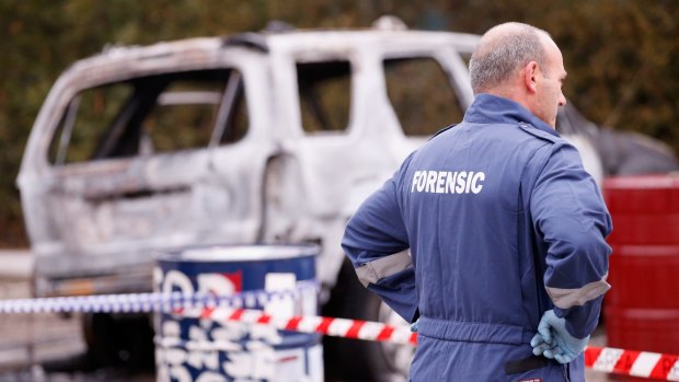 Forensic investigators inspect a car allegedly used in a police shooting in Moonee Ponds on July 7, 2015.