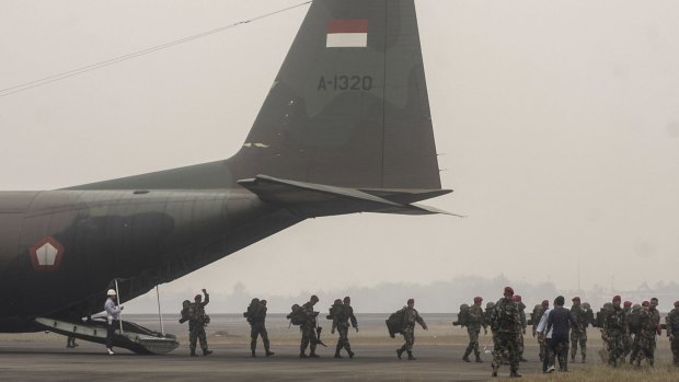 Indonesian soldiers deployed to help contain the massive fire in Palembang last week.