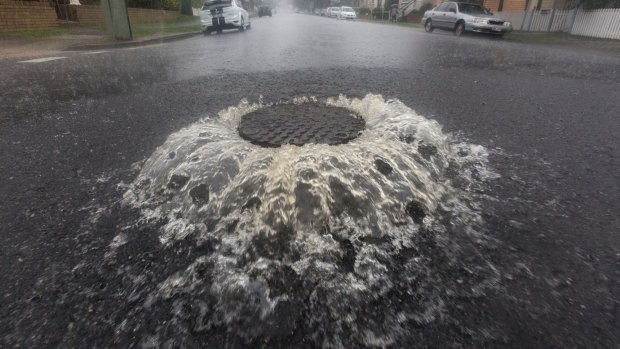 A manhole overflows in Newmarket.