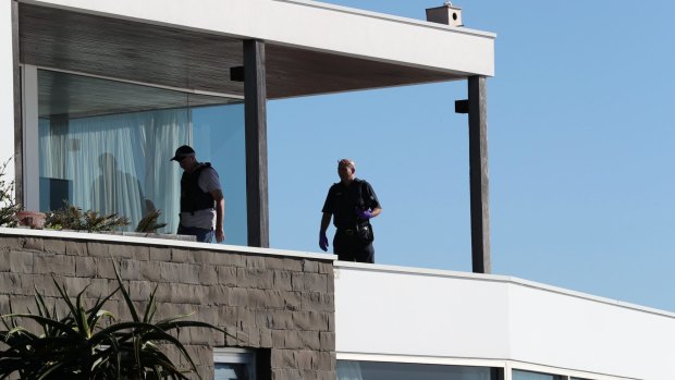 Police search John Ibrahim's clifftop home in Dover Heights.