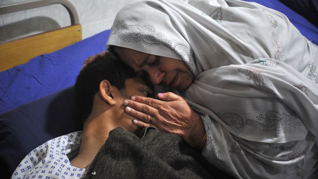 A mother with her son, who was injured in the attack.
