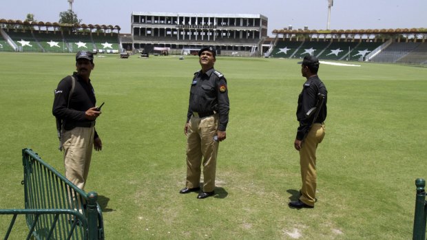 Pakistani police officers take part in a security rehearsal for the series between Pakistan and Zimbabwe at the Gaddafi Stadium in Lahore.