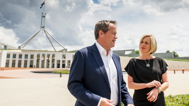 Opposition leader Bill Shorten and ACT Chief Minister Katy Gallagher take a walk around Parliament house after Ms Gallagher announced her departure. 