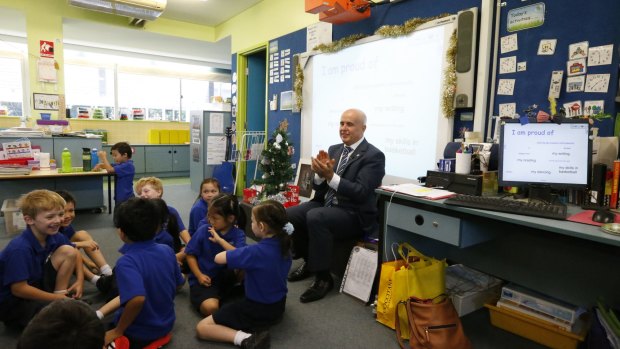 Former NSW education minister Adrian Piccoli during  a 2014 visit to Ultimo Public School. The school  is set to be hit hardest by the influx of residents into the Bays precinct. 